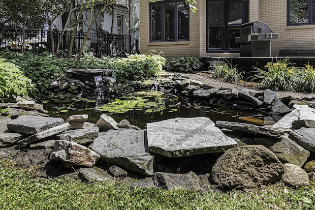 1711 Morton Ave, Ann Arbor, MI 48104 - exterior view of a garden pond and brick siding