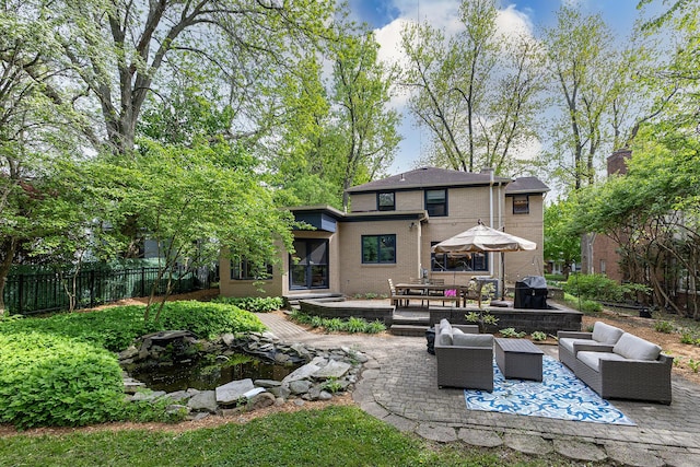 1711 Morton Ave, Ann Arbor, MI 48104 - rear view of property with an outdoor living space, a patio area, a garden pond, and outdoor dining area