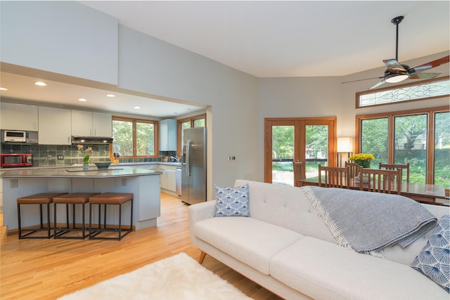 1711 Morton Ave, Ann Arbor, MI 48104 - living area featuring ceiling fan, light wood finished floors, healthy amount of natural light, french doors, and recessed lighting