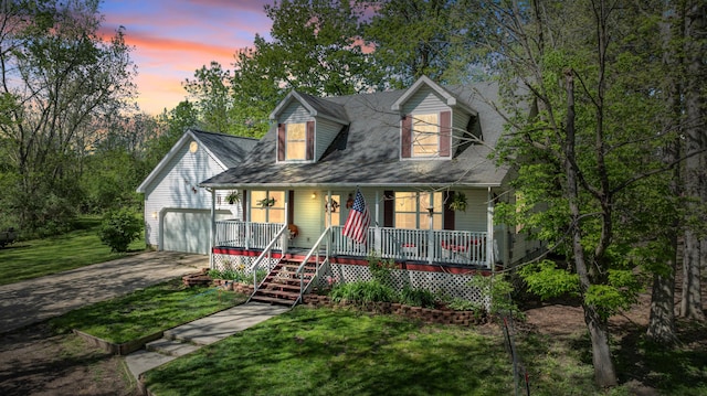 11486 Halsey Rd, Holly, MI 48442 - cape cod home featuring covered porch, driveway, and a front lawn