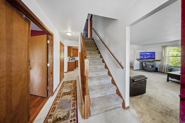 11486 Halsey Rd, Holly, MI 48442 - staircase featuring baseboards