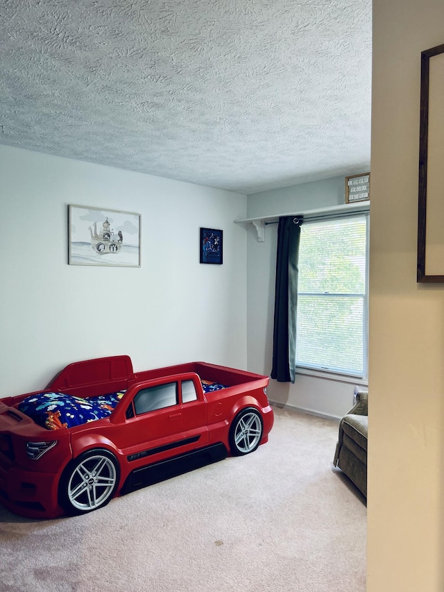 5335 Heathrow Ave, Kalamazoo, MI 49009 - carpeted bedroom with a textured ceiling