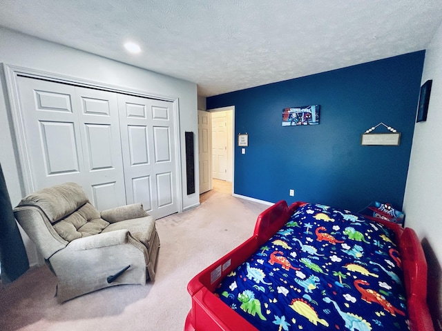 5335 Heathrow Ave, Kalamazoo, MI 49009 - bedroom with carpet floors, a closet, and baseboards