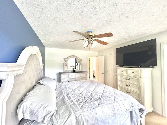 5335 Heathrow Ave, Kalamazoo, MI 49009 - bedroom featuring a textured ceiling, light carpet, and ceiling fan