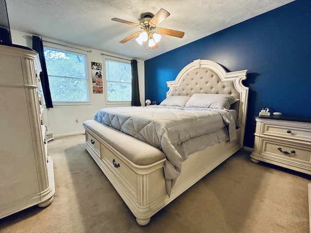 5335 Heathrow Ave, Kalamazoo, MI 49009 - bedroom featuring a textured ceiling, carpet, baseboards, and a ceiling fan