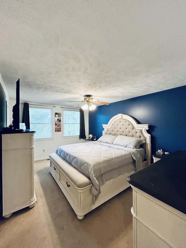 5335 Heathrow Ave, Kalamazoo, MI 49009 - bedroom featuring a textured ceiling, carpet floors, and a ceiling fan