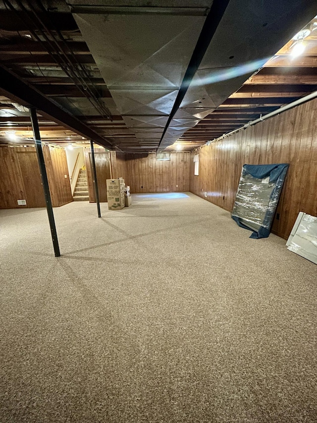 5335 Heathrow Ave, Kalamazoo, MI 49009 - unfinished below grade area featuring stairs, wooden walls, and carpet flooring