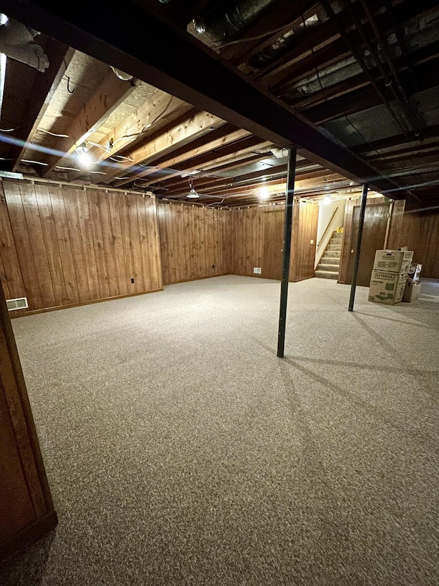 5335 Heathrow Ave, Kalamazoo, MI 49009 - basement featuring stairs and wooden walls
