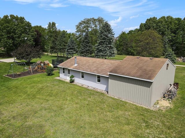 9490 N 12th St, Kalamazoo, MI 49009 - back of house featuring a playground and a yard