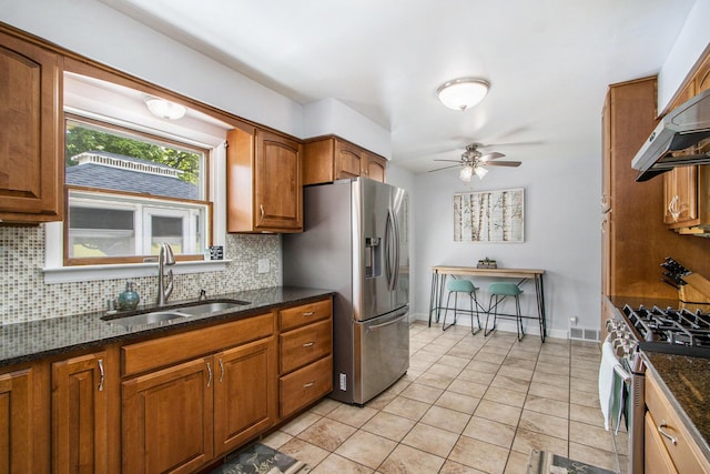 9490 N 12th St, Kalamazoo, MI 49009 - kitchen featuring a sink, appliances with stainless steel finishes, ceiling fan, backsplash, and brown cabinets