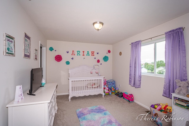 4240 Butternut Dr, Wayland, MI 49348 - carpeted bedroom featuring baseboards and a nursery area