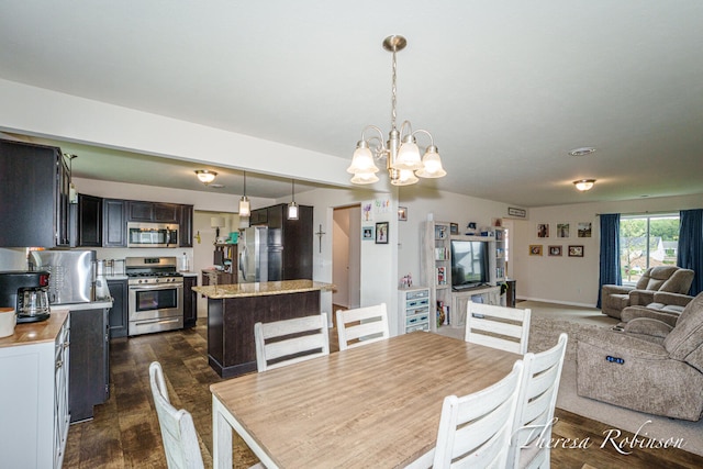 4240 Butternut Dr, Wayland, MI 49348 - dining room featuring a chandelier and dark wood finished floors