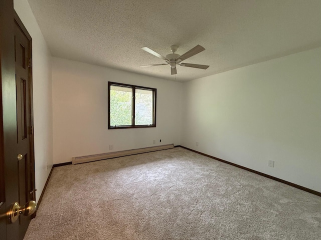 6035 W Trails End Rd, Ludington, MI 49431 - carpeted spare room with baseboard heating, a ceiling fan, a textured ceiling, and baseboards