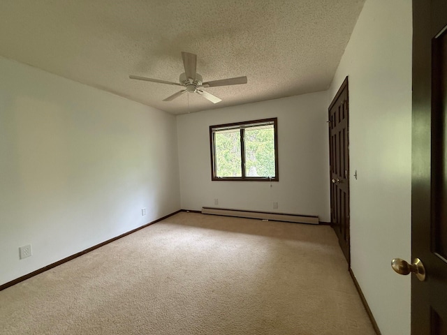6035 W Trails End Rd, Ludington, MI 49431 - empty room featuring baseboard heating, a textured ceiling, light carpet, ceiling fan, and baseboards