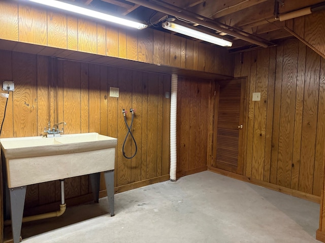 6035 W Trails End Rd, Ludington, MI 49431 - below grade area featuring wooden walls and baseboards