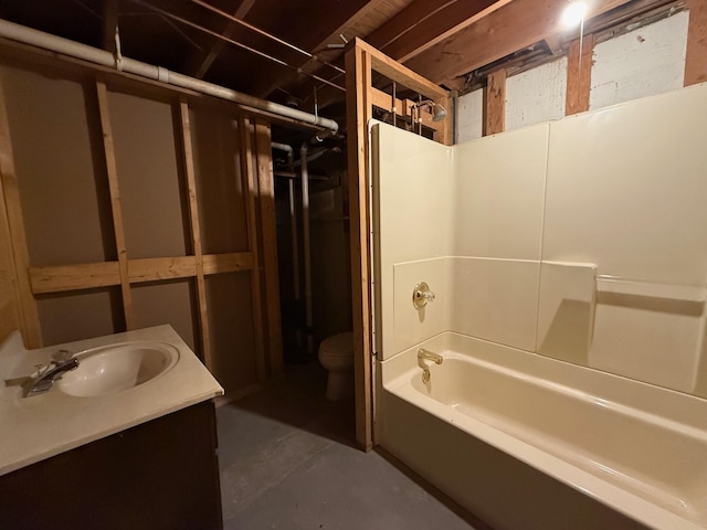 6035 W Trails End Rd, Ludington, MI 49431 - bathroom featuring concrete flooring, toilet, shower / washtub combination, and vanity