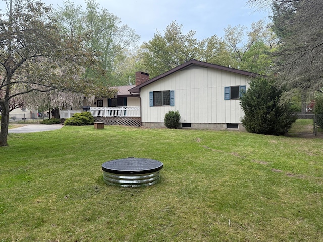 6035 W Trails End Rd, Ludington, MI 49431 - back of house with a chimney