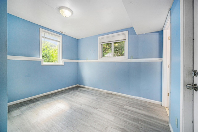 550 1st Ave, Ypsilanti, MI 48197 - spare room featuring healthy amount of natural light, wood finished floors, and baseboards