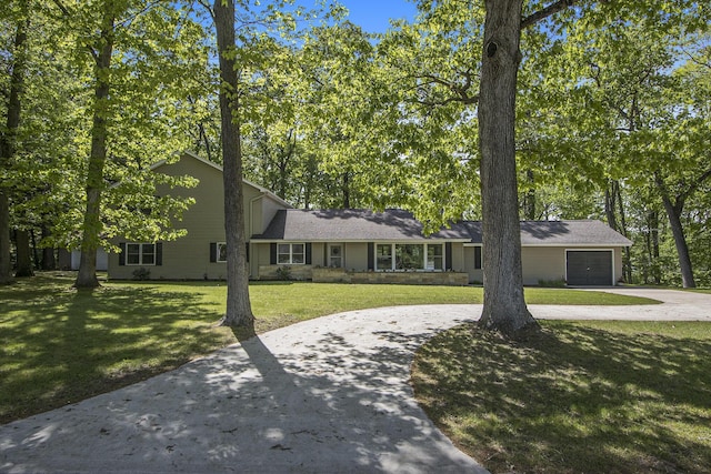 15842 Portage Rd, Vicksburg, MI 49097 - view of front of home with curved driveway, a garage, and a front yard