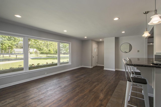15842 Portage Rd, Vicksburg, MI 49097 - unfurnished living room with dark wood-type flooring, recessed lighting, and baseboards