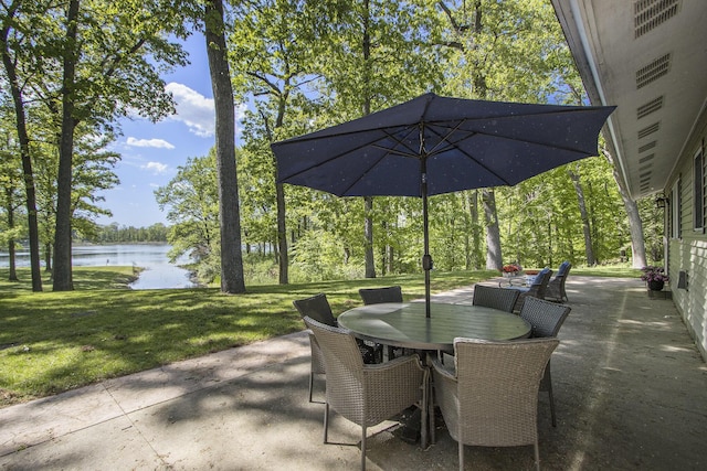 15842 Portage Rd, Vicksburg, MI 49097 - view of patio / terrace with a water view, outdoor dining space, and view of scattered trees