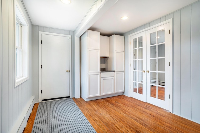 15842 Portage Rd, Vicksburg, MI 49097 - doorway to outside featuring french doors, light wood finished floors, and baseboard heating