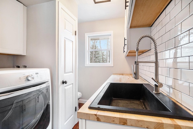 15842 Portage Rd, Vicksburg, MI 49097 - washroom featuring washer / clothes dryer and cabinet space
