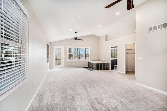 15842 Portage Rd, Vicksburg, MI 49097 - unfurnished living room with ceiling fan, light colored carpet, baseboards, recessed lighting, and high vaulted ceiling