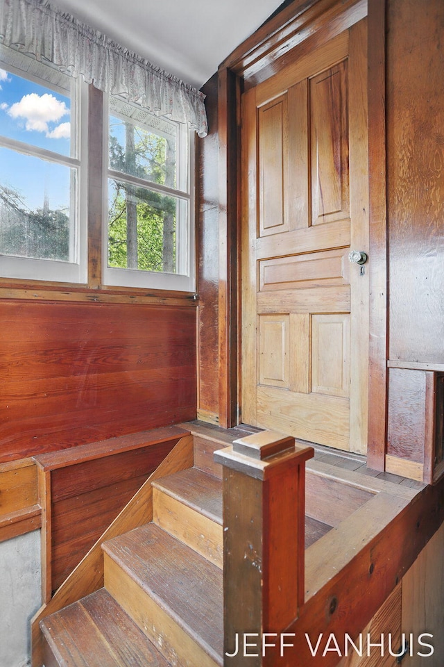 6789 W 76th St, Baldwin, MI 49304 - staircase featuring wooden walls