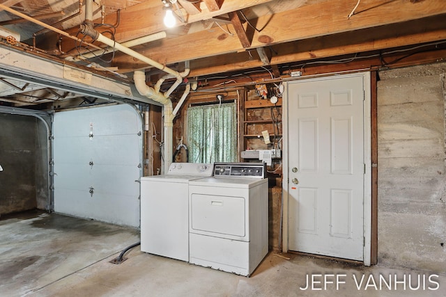 6789 W 76th St, Baldwin, MI 49304 - laundry room with washing machine and clothes dryer and a garage