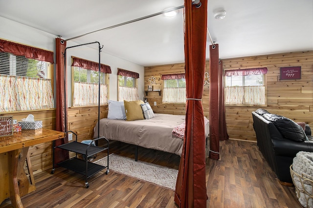 5729 N Bass Lake Rd, Irons, MI 49644 - bedroom with wood walls and wood finished floors