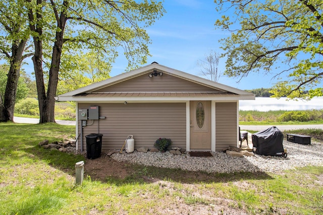 5729 N Bass Lake Rd, Irons, MI 49644 - exterior space featuring a front yard and an outdoor structure