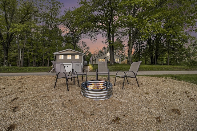 5729 N Bass Lake Rd, Irons, MI 49644 - view of yard at dusk