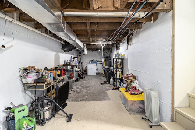 5729 N Bass Lake Rd, Irons, MI 49644 - unfinished basement featuring radiator