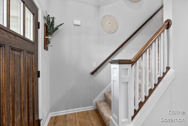12036 Harvest Home Dr, Lowell, MI 49331 - stairs with wood finished floors and baseboards