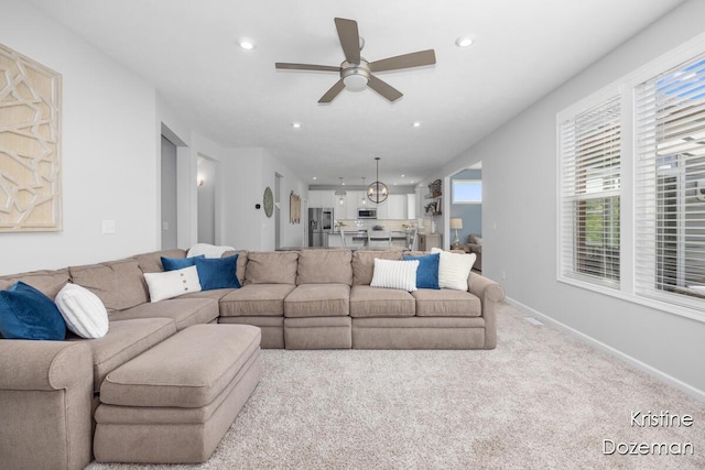12036 Harvest Home Dr, Lowell, MI 49331 - living area with ceiling fan, recessed lighting, carpet flooring, and baseboards