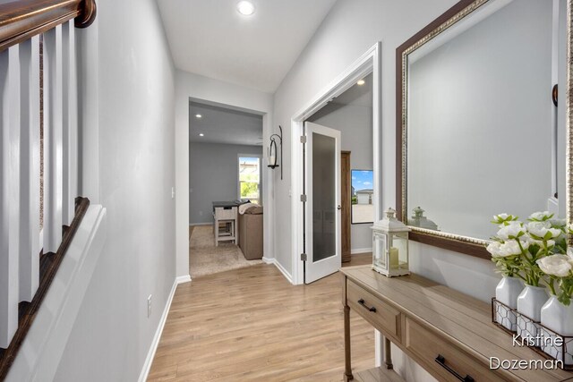 12036 Harvest Home Dr, Lowell, MI 49331 - hall with light wood finished floors, baseboards, and recessed lighting