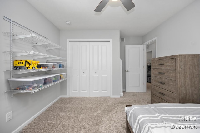 12036 Harvest Home Dr, Lowell, MI 49331 - bedroom featuring carpet flooring, baseboards, a ceiling fan, and a closet