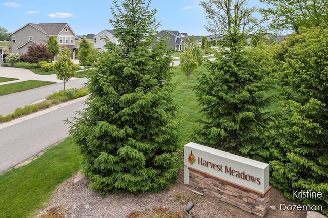 12036 Harvest Home Dr, Lowell, MI 49331 - community sign featuring a residential view