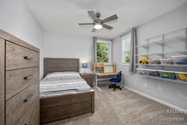 12036 Harvest Home Dr, Lowell, MI 49331 - carpeted bedroom featuring baseboards and a ceiling fan