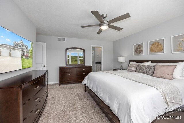 12036 Harvest Home Dr, Lowell, MI 49331 - bedroom featuring light carpet, a ceiling fan, and baseboards