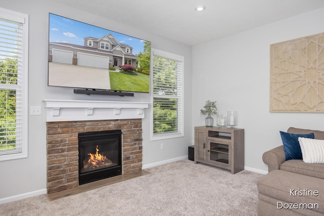 12036 Harvest Home Dr, Lowell, MI 49331 - living room featuring baseboards, carpet floors, a fireplace, and recessed lighting