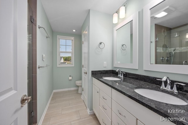 12036 Harvest Home Dr, Lowell, MI 49331 - full bath featuring toilet, a tile shower, double vanity, and baseboards