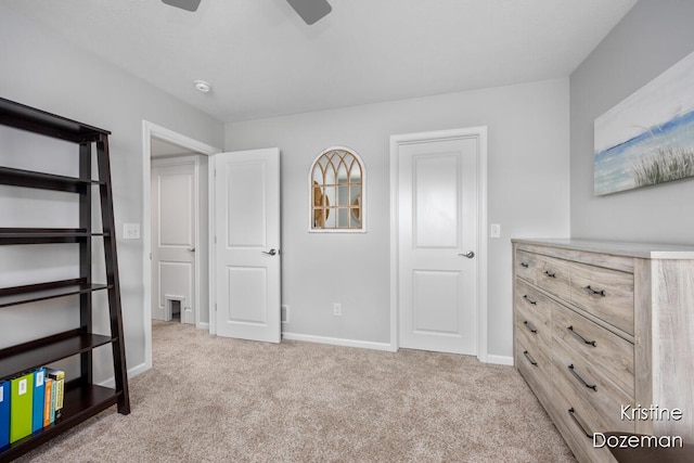 12036 Harvest Home Dr, Lowell, MI 49331 - unfurnished bedroom featuring carpet, baseboards, and a ceiling fan