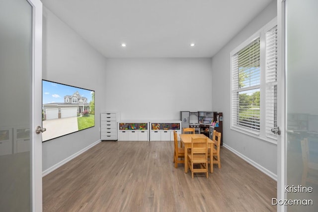 12036 Harvest Home Dr, Lowell, MI 49331 - game room with wood finished floors, baseboards, and recessed lighting