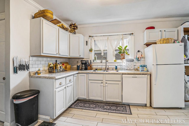 1212 Johnston St SE, Grand Rapids, MI 49507 - kitchen featuring white appliances, a sink, tasteful backsplash, light countertops, and crown molding