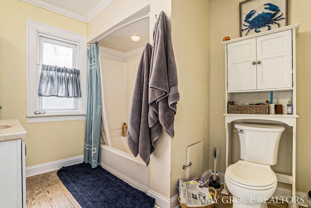 1212 Johnston St SE, Grand Rapids, MI 49507 - bathroom with ornamental molding, toilet, vanity, baseboards, and shower / bathtub combination with curtain