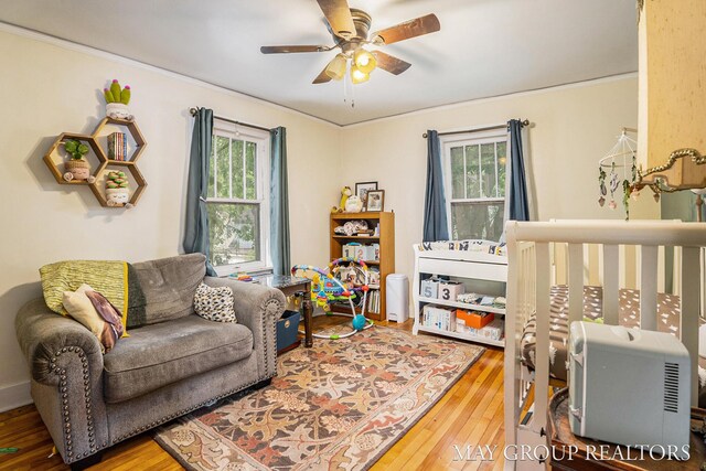1212 Johnston St SE, Grand Rapids, MI 49507 - living room with wood-type flooring, plenty of natural light, ceiling fan, and ornamental molding