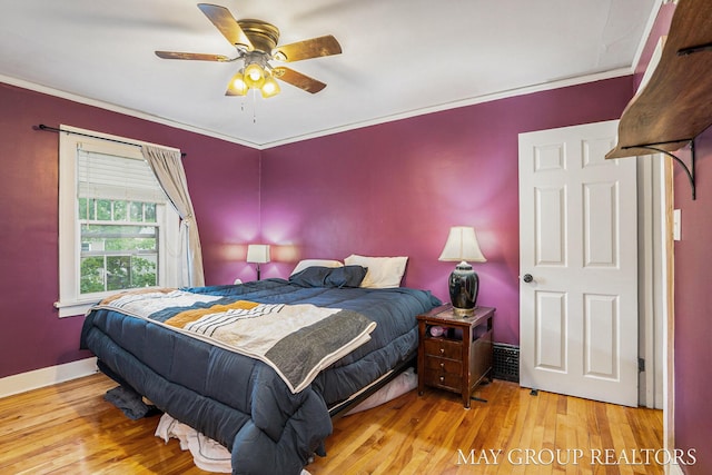 1212 Johnston St SE, Grand Rapids, MI 49507 - bedroom featuring wood finished floors, crown molding, a ceiling fan, and baseboards