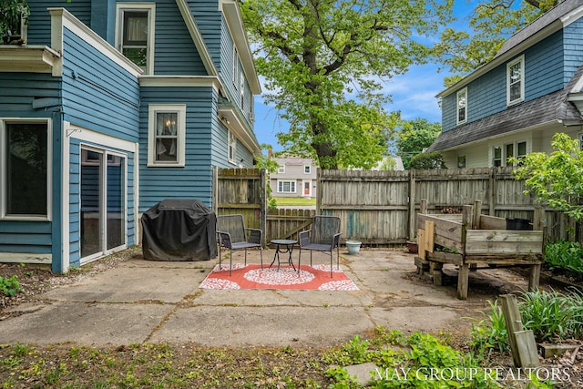 1212 Johnston St SE, Grand Rapids, MI 49507 - view of patio featuring a grill
